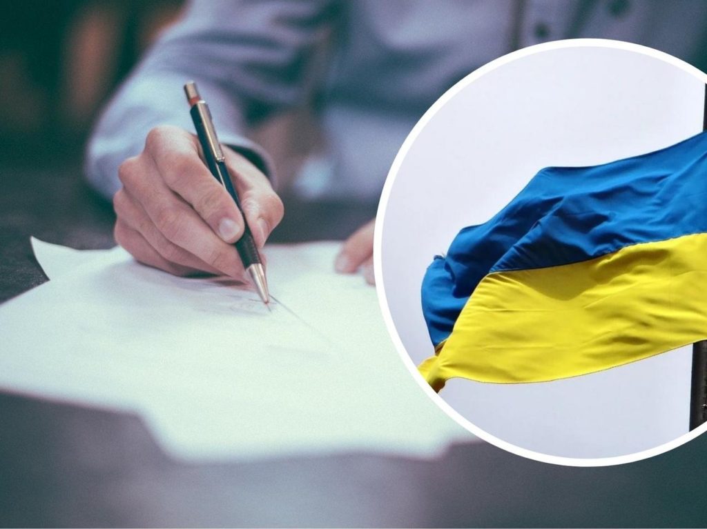 człowiek piszący po kartce papieru i flaga ukrainy